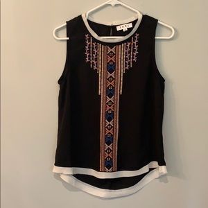 Black, embroidered sleeveless blouse